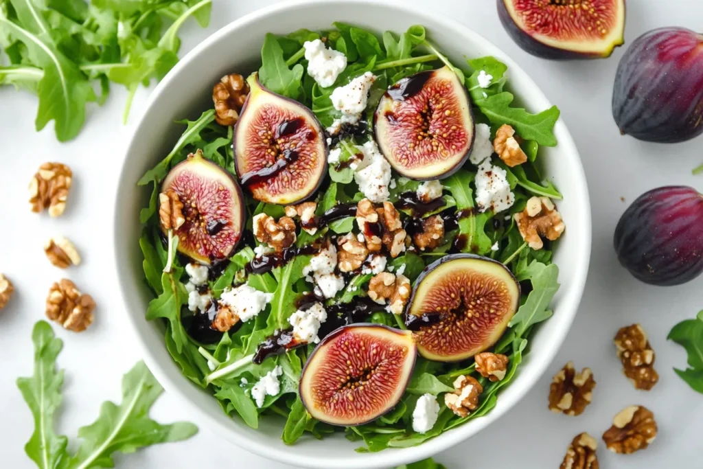 Fresh fig salad with arugula, nuts, and goat cheese